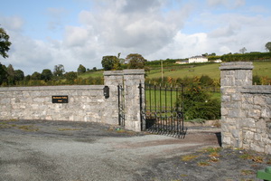 The first of several entrances on the north side of the road