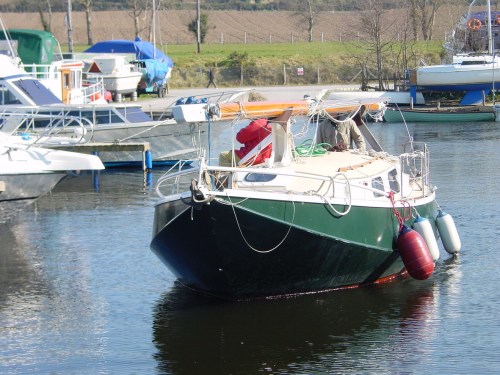Dutch steel boat heading out under power
