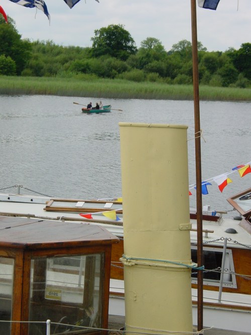 hare-krishna-monk-rowing-01_resize Rowing a visitor ashore