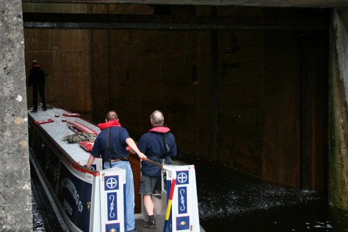 The middle gate has lifted and the boat enters the upper chamber