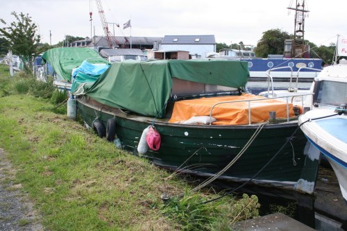 Green-hulled wooden boat afloat at Lowtown 1_resize Green boat afloat